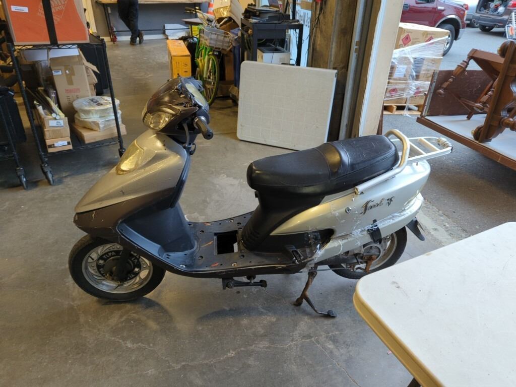 48V ELECTRIC SCOOTER HAS POWER AND CHARGER, SHELL HAS DAMAGE INCLUDES ...