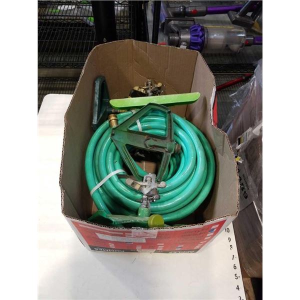 BOX OF GARDEN HOSE AND 4 SPRINKLERS