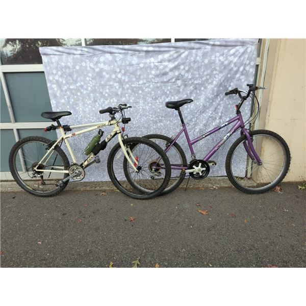 PURPLE NEXT BIKE AND WHIITE ROCKY MOUNTAIN BIKE