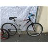 Image 2 : BLACK TREK BIKE. AND RED BMX BIKE