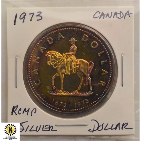 1973 NICELY TONED RCMP SILVER DOLLAR