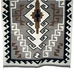 Navajo all naturals wearing blanket