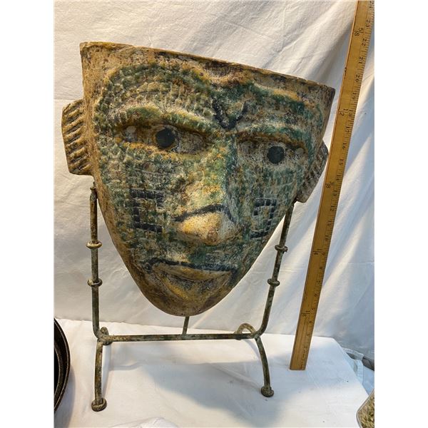 Pottery face on stand