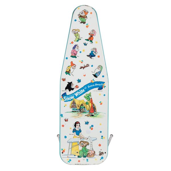 A Snow White Tin Litho Ironing Board.