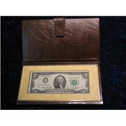 2296. Series 1974 $2. Bill in Holder.