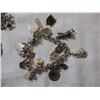 Image 2 : Sterling charm bracelet (15+ charms) other sterling pieces, vintage rings, religious, metal, etc