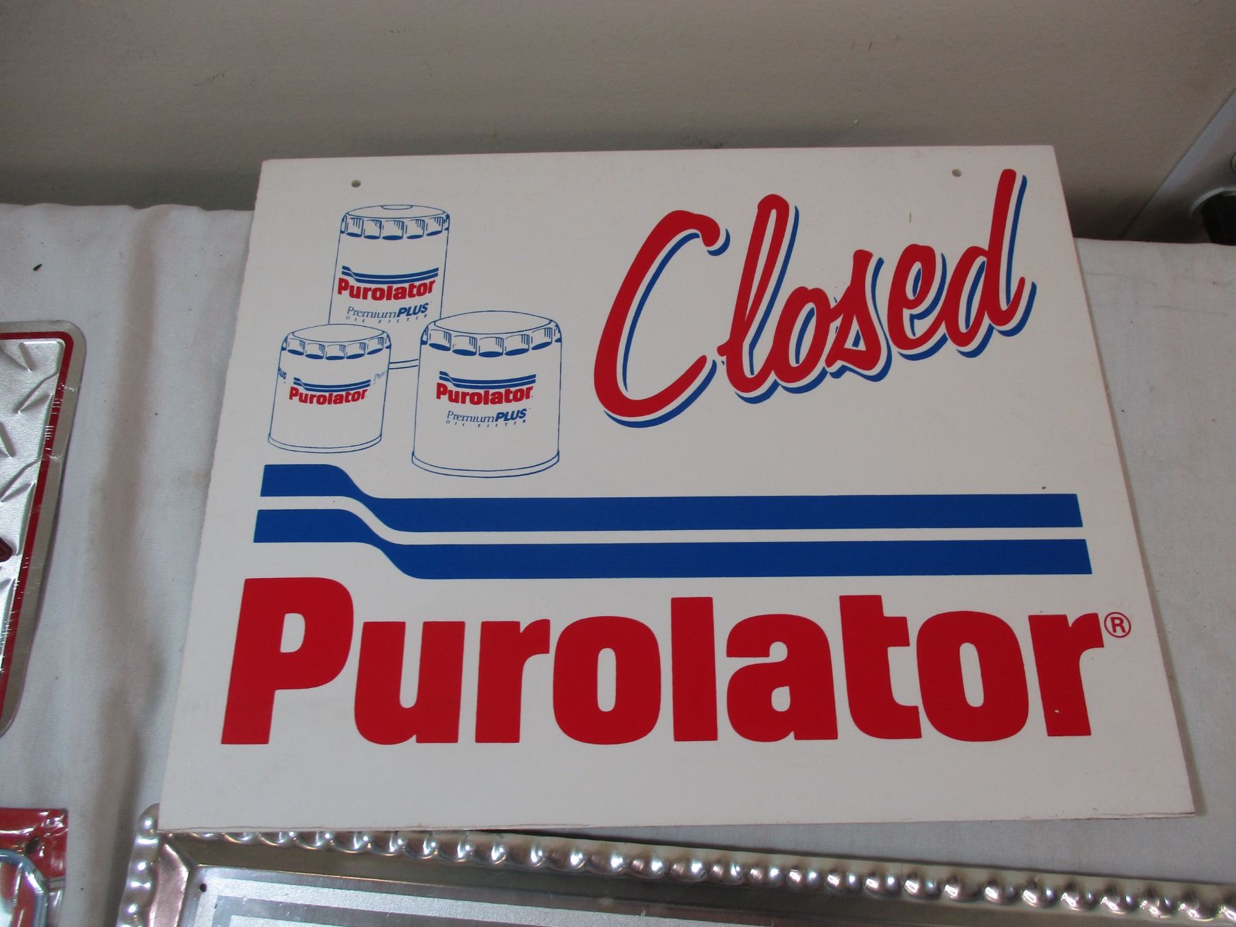 Barrett Jackson license plate + Purolator Open/Closed sign + Coca cola ...