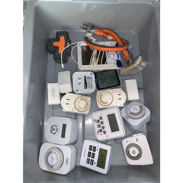 Bin Lot of assorted plug in timers and plugs