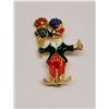 Image 1 : 31)  GOLD TONE WITH RED, BLACK AND WHITE