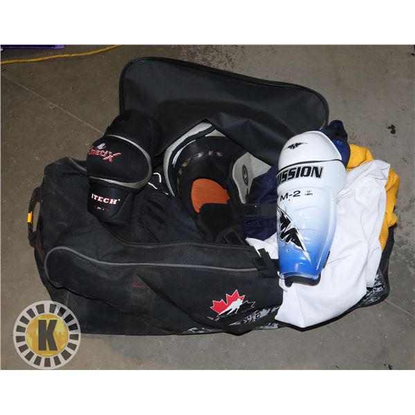 TEAM CANADA HOCKEY BAG FULL OF USED HOCKEY