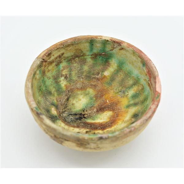 AN ANCIENT ISLAMIC ABBASID SPLASHED GLAZED CERAMIC BOWL