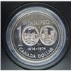 Image 1 : 1974 Winnipeg Centennial Specimen Silver Dollar. Bright White. Housed in its original RCM black clam
