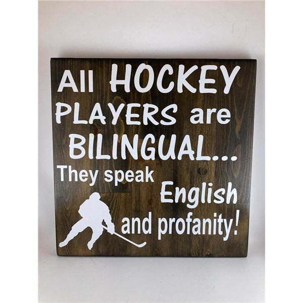 All Hockey players are bilingual.. They speak English and profanity 12X12 Inches. Made of Pine. Hook