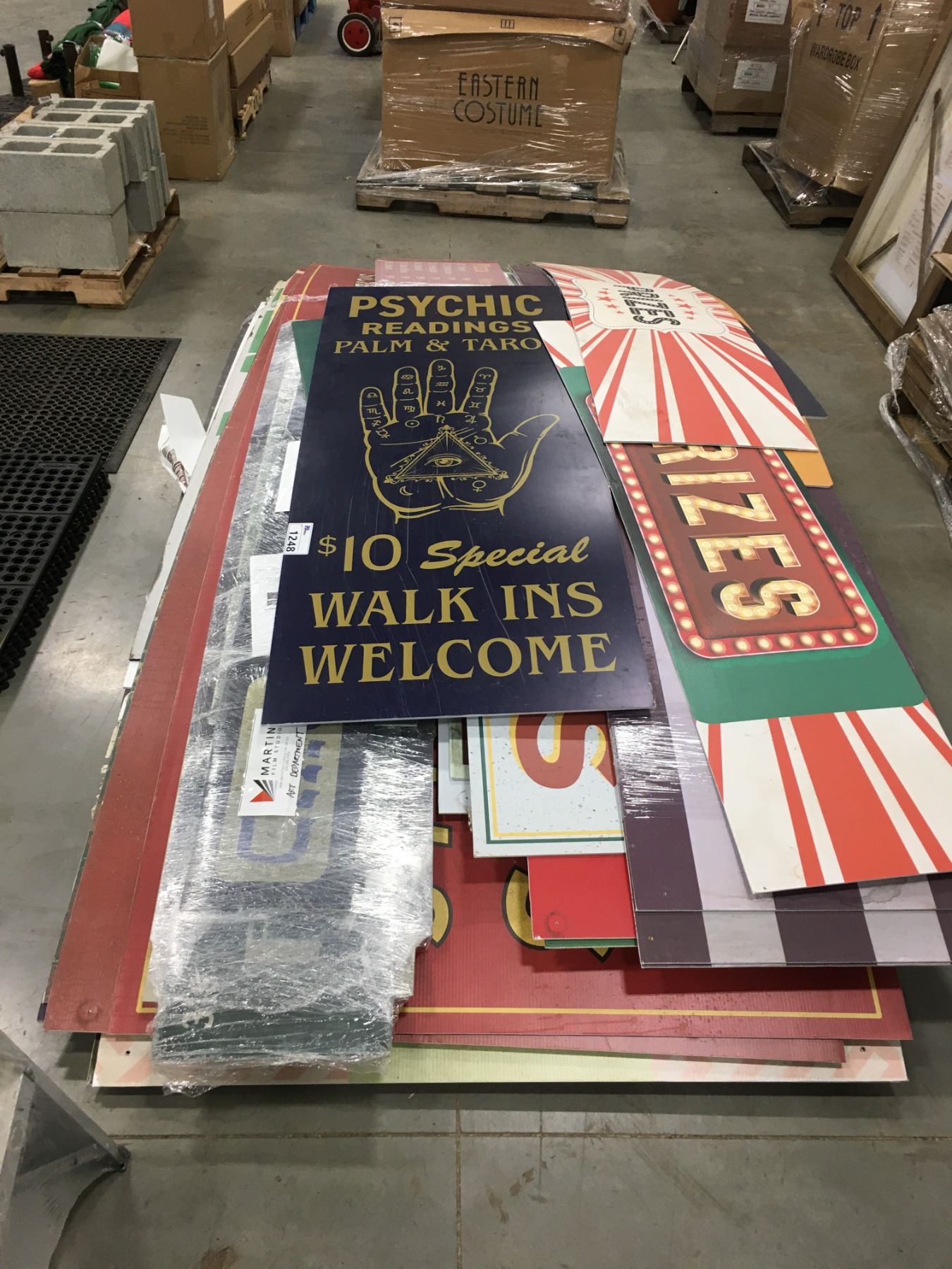 PALLET LOT OF ASSORTED FILM INDUSTRY PROP ADVERTISING SIGNAGE