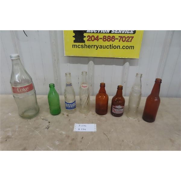 8 Assorted Bottles; 1.5L Coke, 10 oz Brown Stubby, Pepsi, Mission plus more 