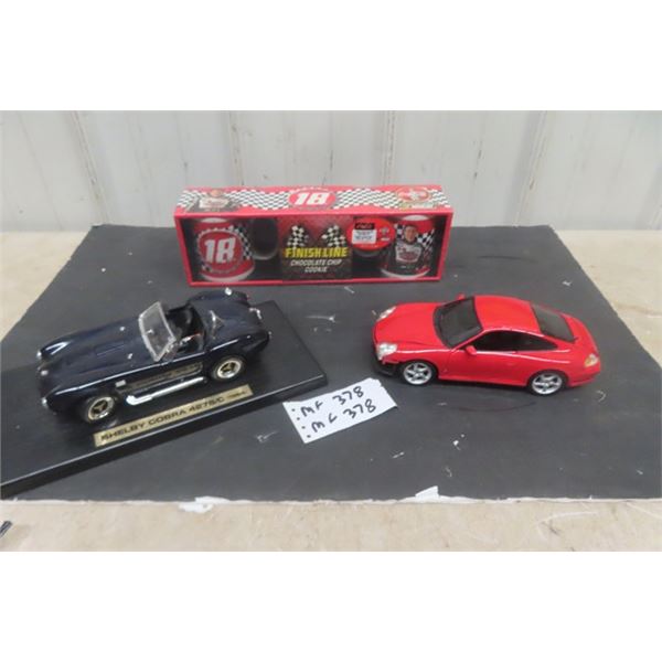 2 Die Cast Cars; 1) 1964 Shelby Cobra, 1) Porsche + 1 Nascar/Coca-Cola Sealed Pair of Coffee Mugs