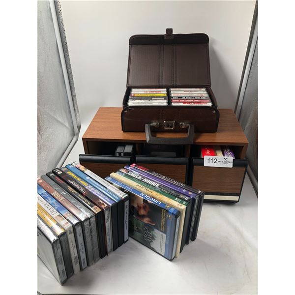 Assortment of C.D. s And Cassettes And DVDs With Storage