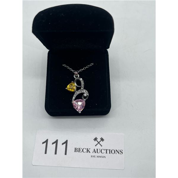 Silver necklace with pink and yellow gemstones