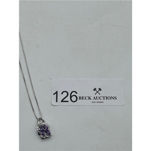 Silver necklace with purple gemstones
