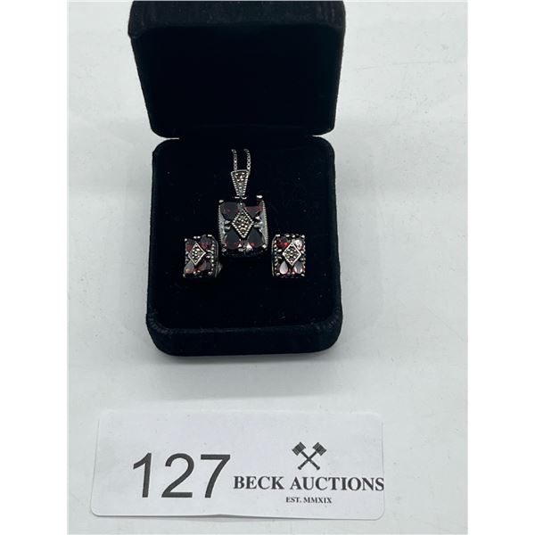 Sterling silver necklace and earring set with red gemstones