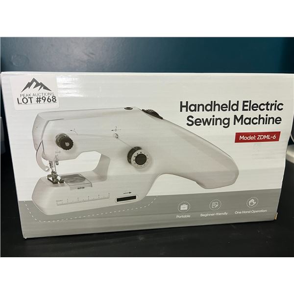 Lot of 1 Handheld Electric Sewing Machine