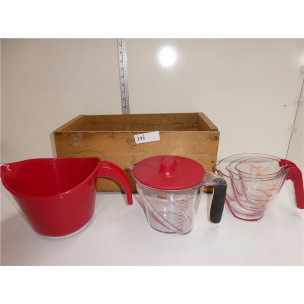 measuring cups, wooden crate