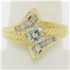 Image 1 : 18k Yellow and White Gold 0.90 ctw Round and Baguette Diamond Ring