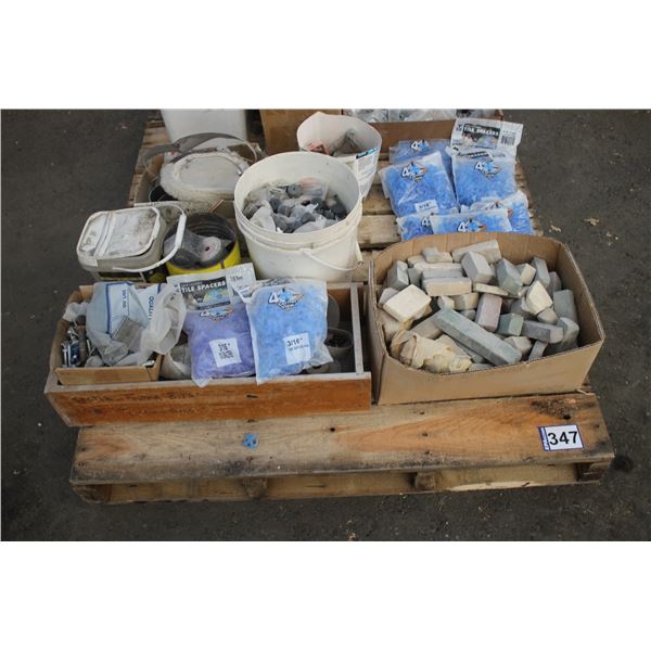 Pallet of tile spacers, hanger brackets, screws, sanding belts, filler sticks and misc.