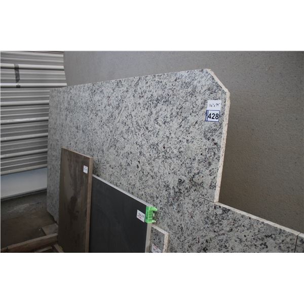 4- Slabs, Various sizes x 1 1/4" thick,- Granite and 1 1/4" thick,- Quartz Caesarstone 2003 (grey Pc