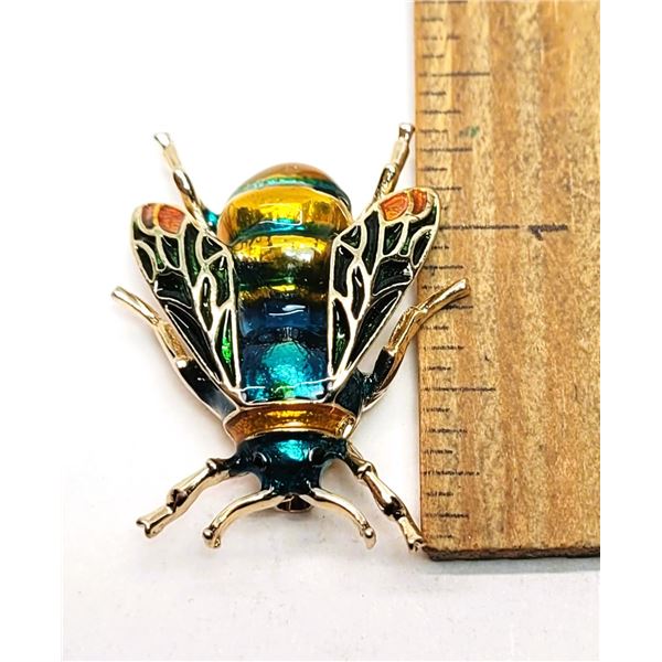 9)  GOLD TONE WITH SHADES OF BLUE, GREEN AND