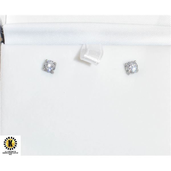 PAIR OF SILVER TONE STUD EARRINGS W/ UNKNOWN
