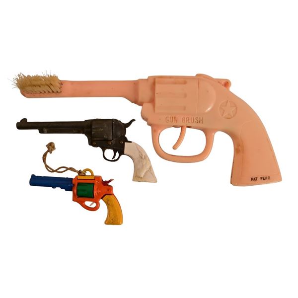 Three Miniature Toy Cowboy Pistols