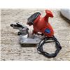 Image 1 : Powerfist chainsaw sharpener (powers on)