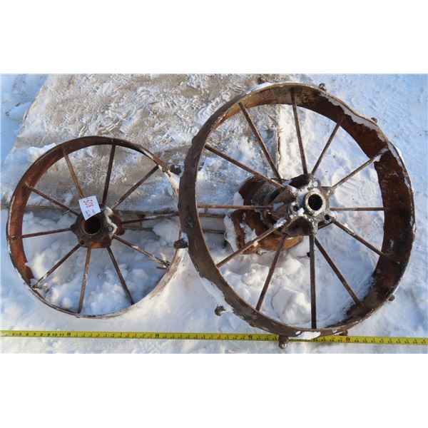 2 Antique metal wheels (1 is 25" diameter. 1 is 29.5" diameter)