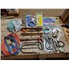 Image 1 : LARGE ASSORTMENT OF TOOLS - ELECTRICAL CORDS, SAWS, HITCH, DRAIN AUGER, TAPE MEASURE, ETC