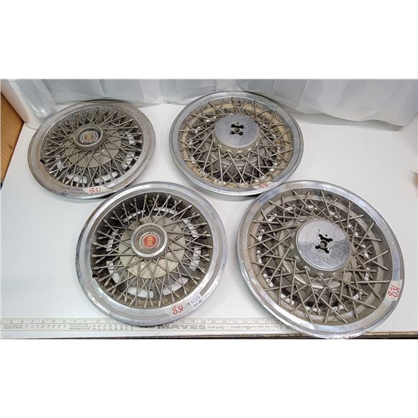 2 pairs of assorted hubcaps