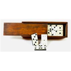 Antique cased set of ivory and black ebony dominos