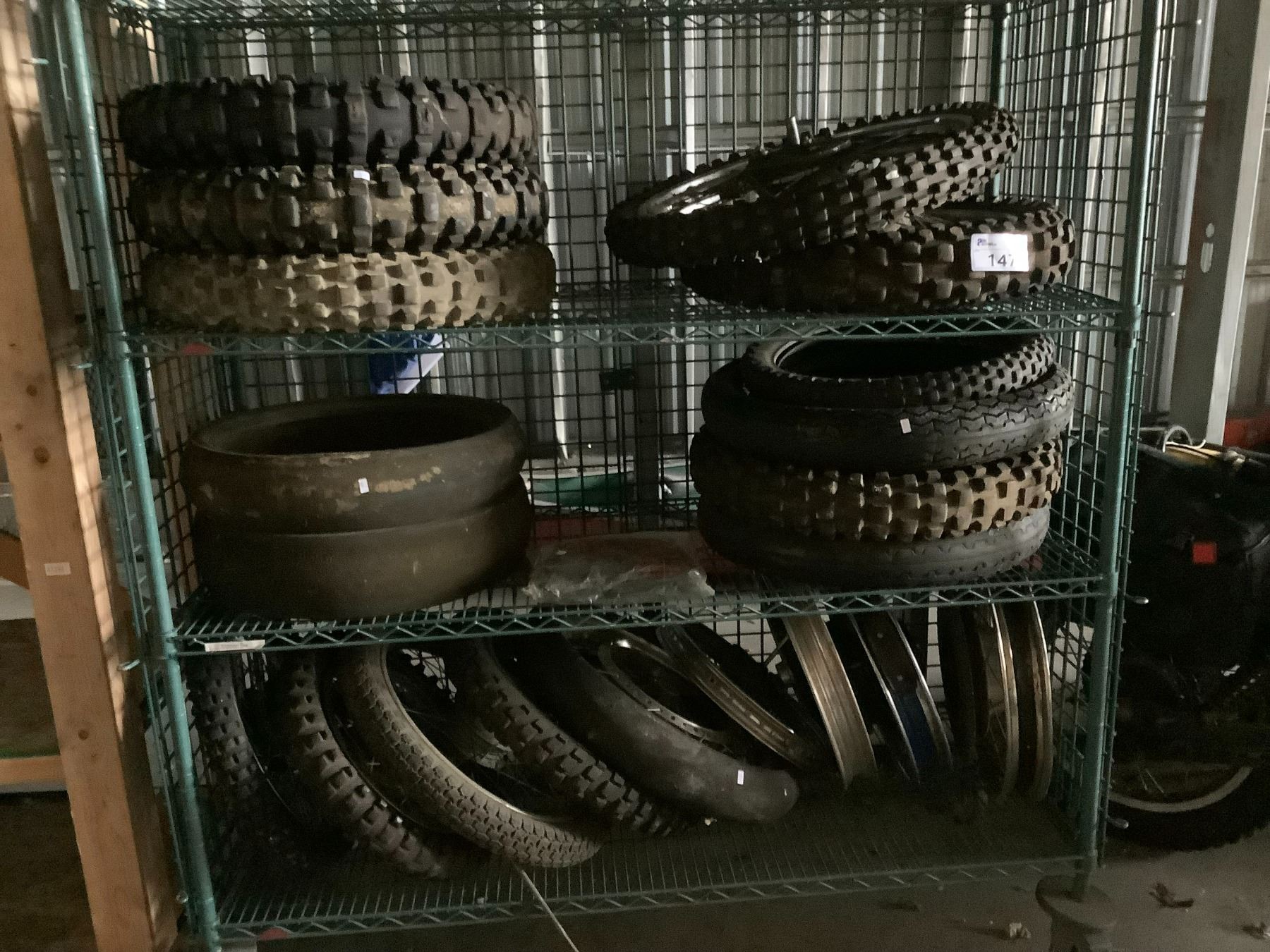 ENTIRE GREEN RACK OF MOTORCYCLE TIRES, AND RIMS, *RACK NOT INCLUDED*