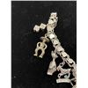 Image 2 : STERLING SILVER CHARM BRACELET WITH ASSORTED CHARMS