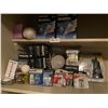 Image 1 : Closet shelf full of light bulbs of different watts and batteries