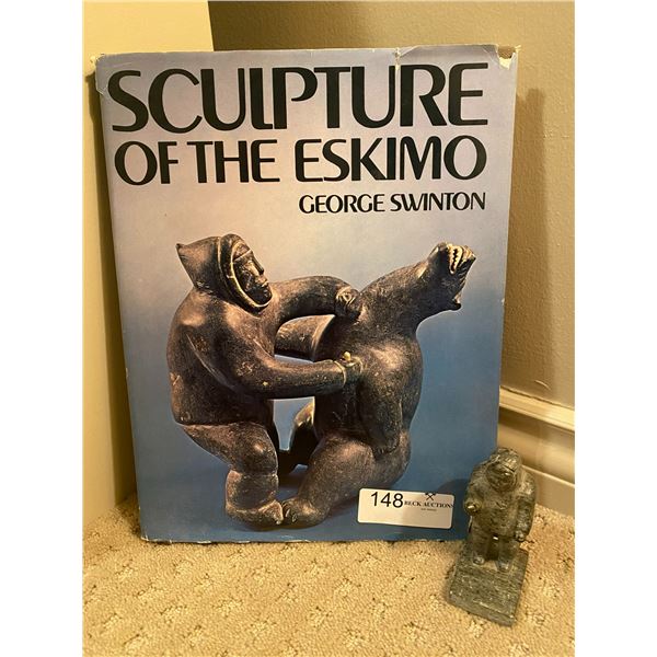 Sculpture of the Eskimo by George Swinton and miniature eskimo statue