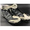 Image 1 : CHRIS WELLS DUAL SIGNED GAME USED FOOTBALL CLEATS (JSA/CARDINALS COA)