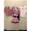 Image 3 : "Ivy + Bean Movie" Rack full of assorted kids' outfits - includes ballet outfits/ sweaters/ shorts/ 