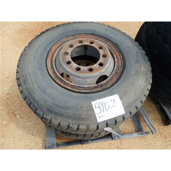 (2) 10.00R20 tires & rims (A-7)