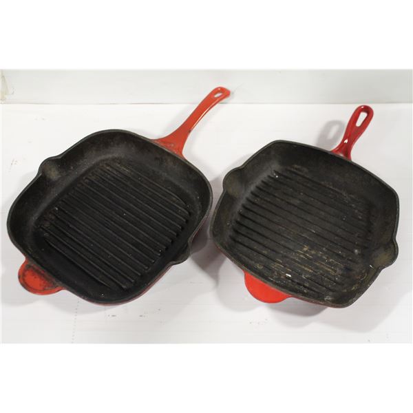 TWO RED ENAMELED CAST IRON PANS W/ HANDLES - 10" & 11"
