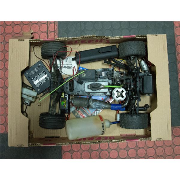 BOX W/ RC GAS CAR PARTS AND ACCESSORIES