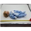 Image 1 : A Porcelain Baby Doll in a Blue Onesie