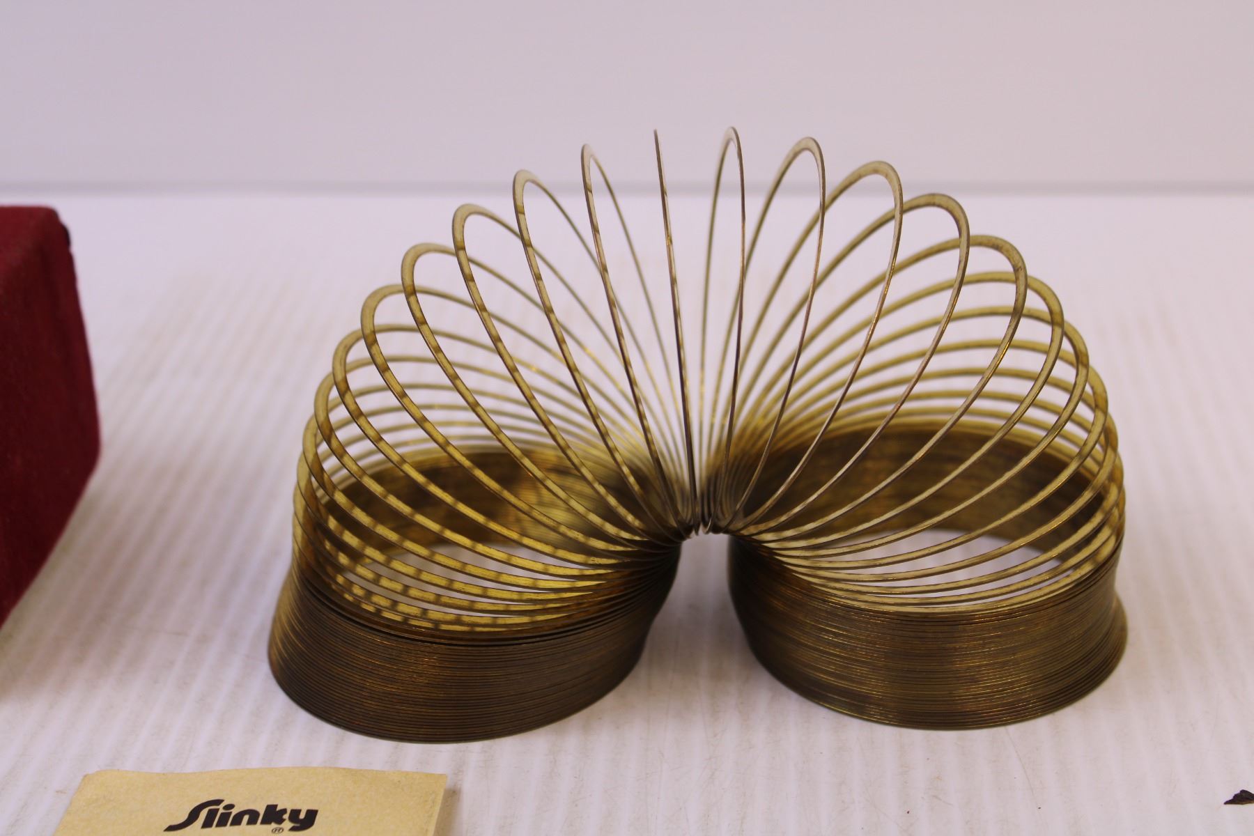 40th Anniversary Edition Brass Slinky - Bodnarus Auctioneering