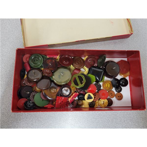 Box of Bakelite buttons and buckles