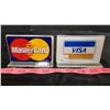 Image 10 : Credit card logos, pink glass piggy bank and clay piggy bank